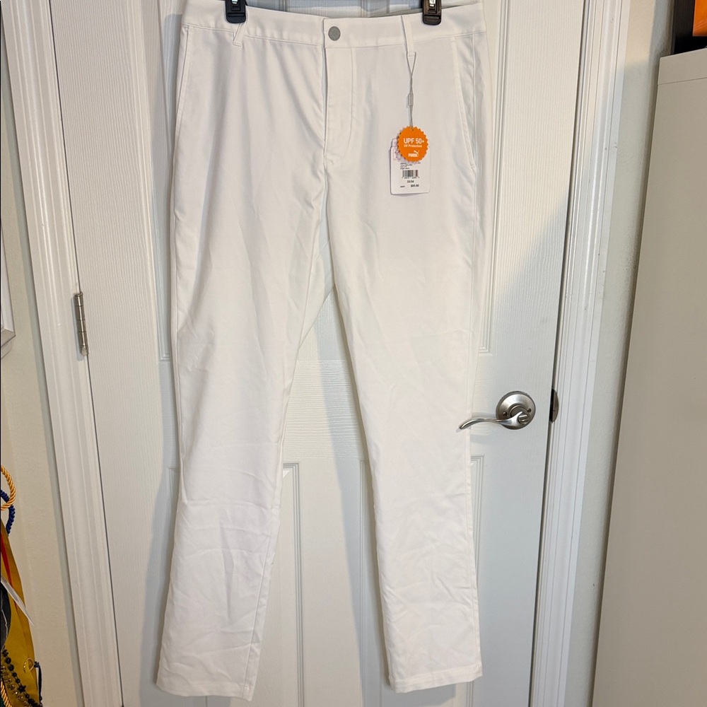 NEW WITH TAGS Puma mens White tailored fit golf pants. Stretch waistband UPF 50